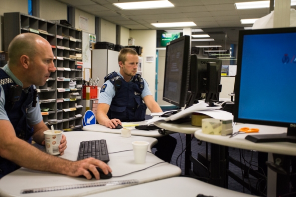 Constables Richard Briscoe (left) and Anthony Davidson complete paperwork at Wellington Central police station.